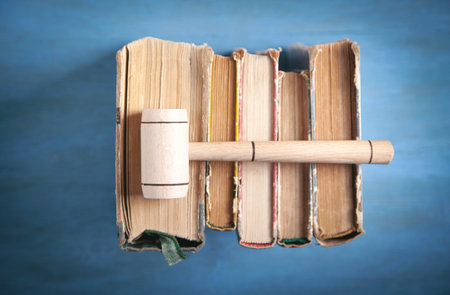 Judge gavel and book on the blue background.の写真素材