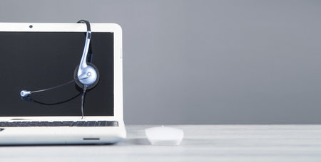 Customer service headset and laptop computer.