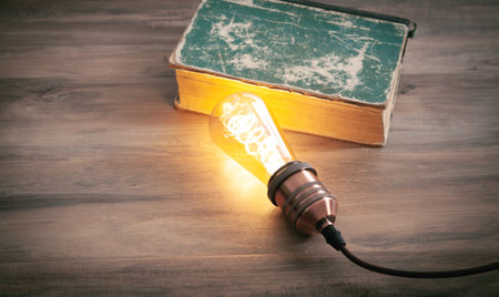 Light bulb and book. knowledge and wisdomの写真素材