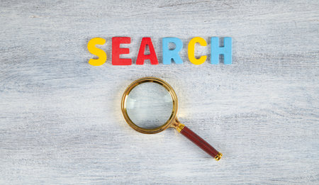 Colorful word Search with magnifying glass.の写真素材