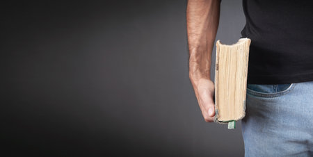 Caucasian man holding bible. religion