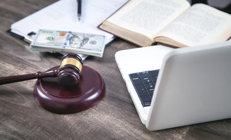 Judge workplace. Judge gavel, money, book, computer, document.の写真素材