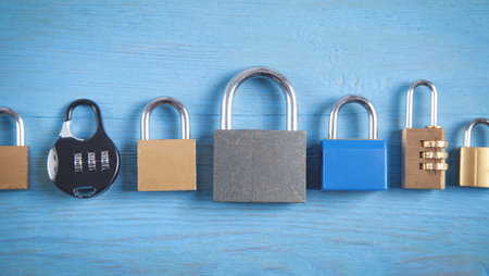 Different padlocks on the blue background.の写真素材