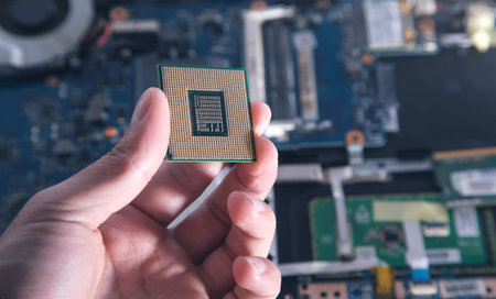 Technician hand holding cpu processor of pc.の写真素材