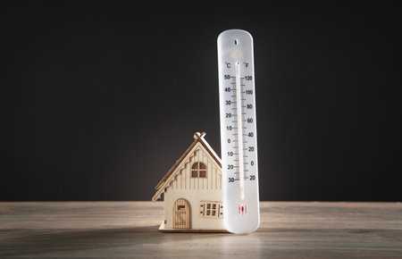 House model with a thermometer on the table.の写真素材