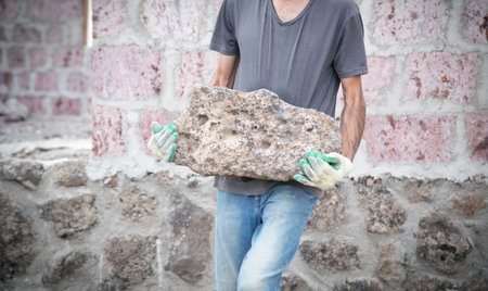 Construction worker holding a quartz stone.の写真素材