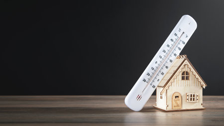 House model with a thermometer on the table.の写真素材