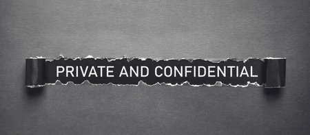Text Private and Confidential on torn paper.の写真素材