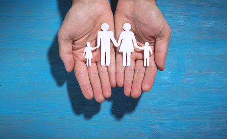Human hands showing paper cut family.の写真素材