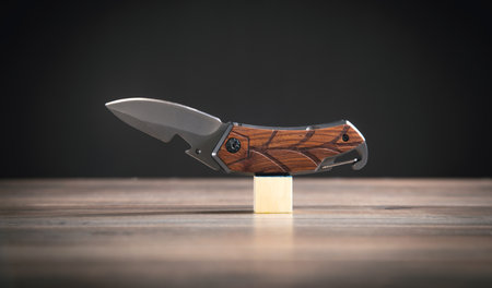 Brown knife on the wooden table.の写真素材