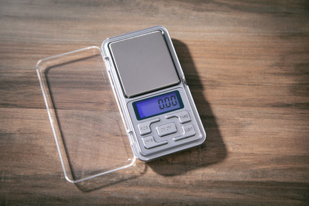 Small digital jewelry scales on the table.の写真素材