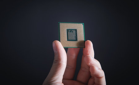 Technician hand holding cpu processor of pc.の写真素材