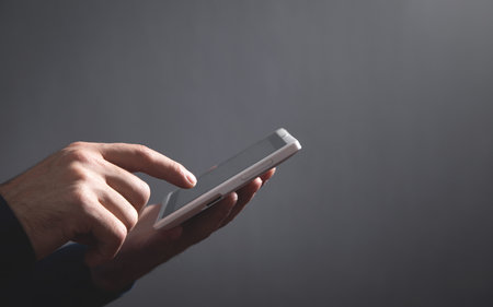 Businessman using white digital tablet.