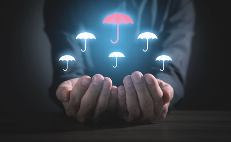 man holding umbrellas. leadership. businessの写真素材