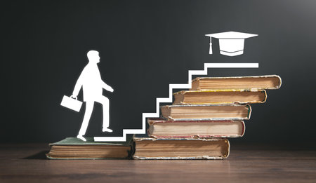 Man walking up stairs from books. education. Knowledge. Successの写真素材