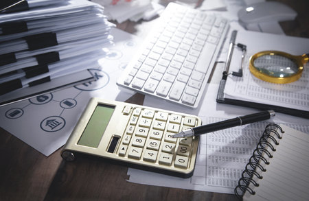 Calculator, keyboard, pen, documents, magnifying glass. business. Accountingの写真素材