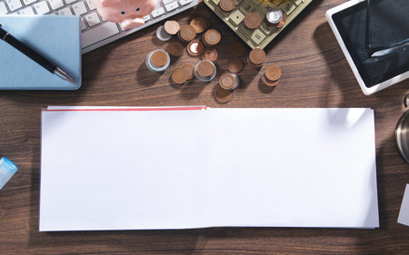 Empty notepad, coins, pen and business objects.の写真素材