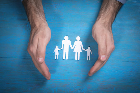 Human hands showing paper cut family.の写真素材