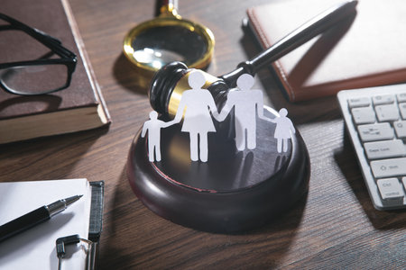 Paper cut family, judge gavel, book and other objects. family lawの写真素材