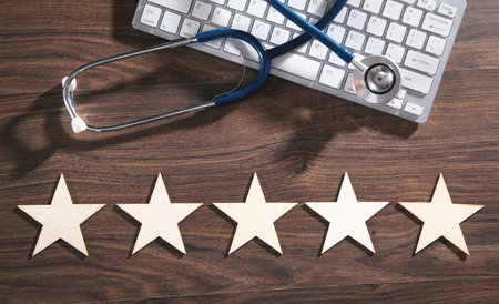 Stars, stethoscope and computer keyboard. experience. satisfaction