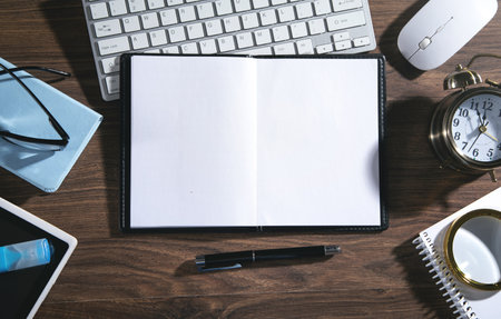 Empty notepad, computer keyboard and other business objects.の写真素材