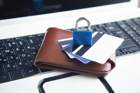 Padlock, wallet and credit cards on the computer keyboard. credit card securityの写真素材