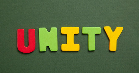 Colorful word Unity on green background.