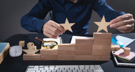 Man holding stars on wooden block. Increase rating