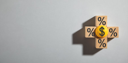 Dollar and percent symbols on wooden cubes.