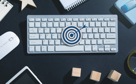 Target dart on wooden round with a business object. Achievement. Goalの写真素材
