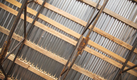 Installation of sheets of metal tiles of roof. Roof construction