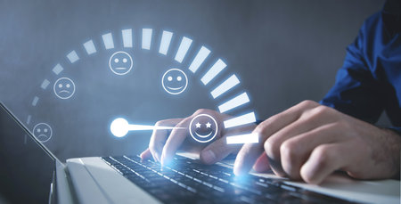 Male hand typing in computer keyboard. Customer emotions satisfaction meter