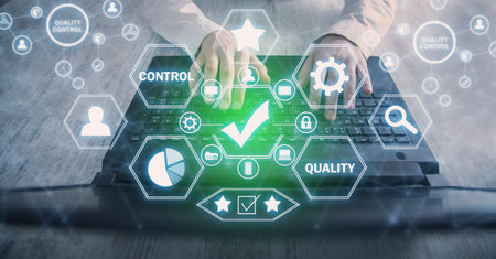 working on computer. Quality control, Guarantees, Standardsの写真素材