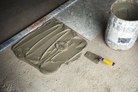Laying floor tiles. Renovating the floor