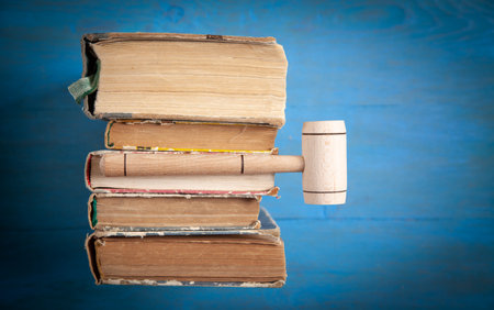 Judge gavel and book on the blue background.の写真素材