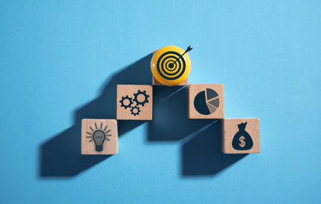 Business symbols on wooden cubes. business process. Goal. Achievement