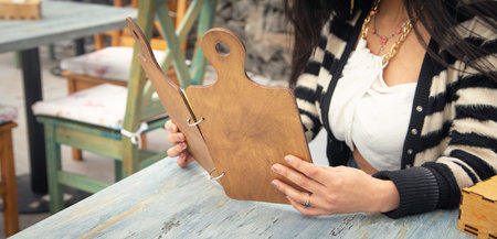 Caucasian woman reading menu in cafe.の写真素材
