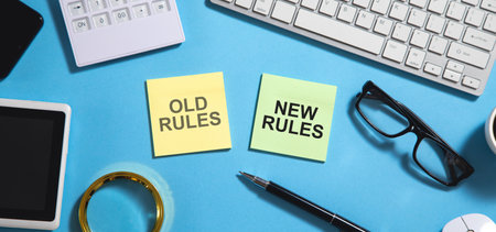 Old Rules and New Rules text on sticky notes with a business object.