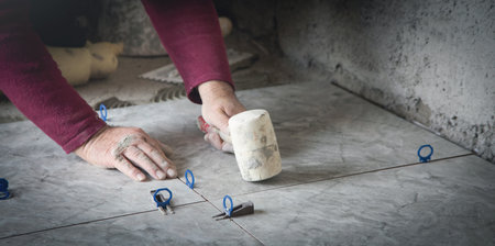 Laying floor tiles. Renovating the floor