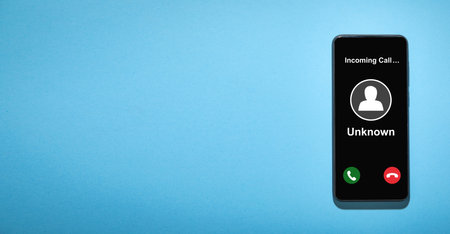 Mobile phone with incoming call from unknown caller.の写真素材
