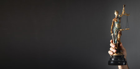 Man holding Statue of Lady Justice. lawの写真素材