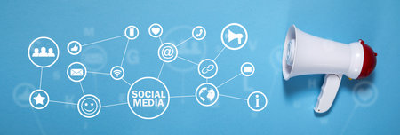 Megaphone on the blue background. Social mediaの写真素材