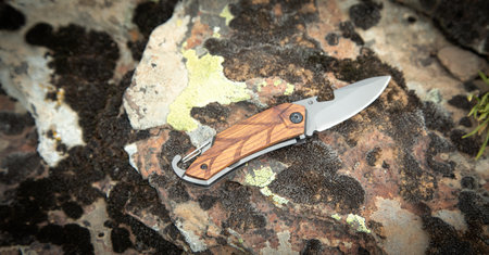 Knife on stone texture or background.