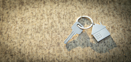 House keys on wooden background.の写真素材