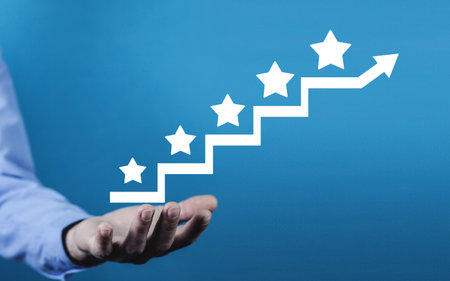 Male hand showing 5 stars on stairs. Increase rating