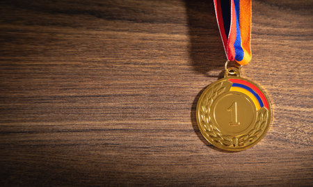 Medal awards for winner on wooden background.