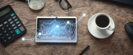 Digital tablet with a growth graph in screen.