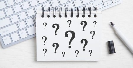 Question mark on notepad. business concept