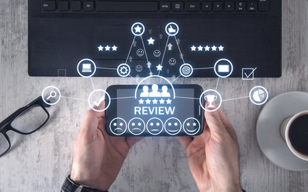 Man showing smart phone. review. customer satisfaction. experienceの写真素材