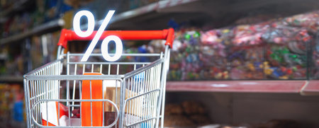Shopping cart and percent symbol.の写真素材